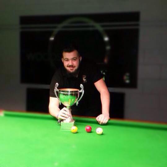 Callum Davison holding the trophy after winning the Norfolk billiards tounament at Woodside Snooker Centre.