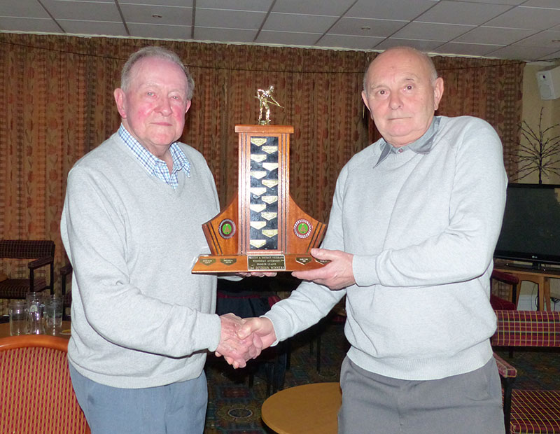 Hoole Village Hall Captain, Alan Greenwood, takes the Division 2 trophy from Dennis Wilkinson. 